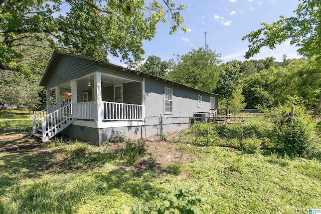 view of property exterior with a porch