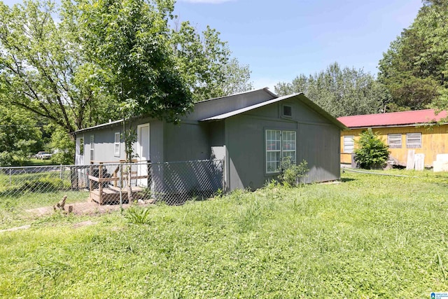 view of home's exterior with a lawn