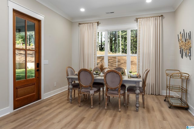 kitchen with tasteful backsplash, a sink, light countertops, premium range hood, and stainless steel appliances