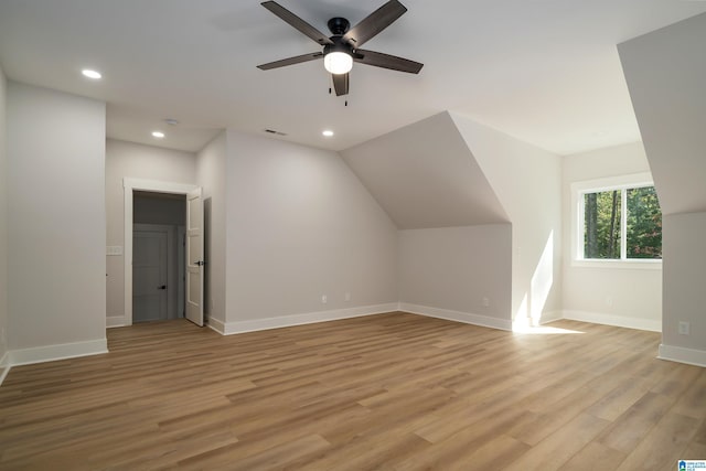 bedroom featuring baseboards, recessed lighting, and wood finished floors