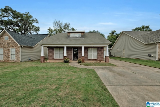 view of front of home with a porch and a front lawn