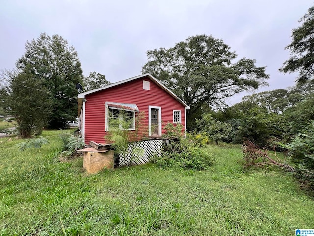 view of outbuilding with a yard