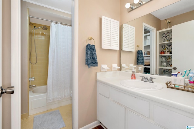 bathroom with shower / bath combo with shower curtain, tile patterned flooring, and vanity