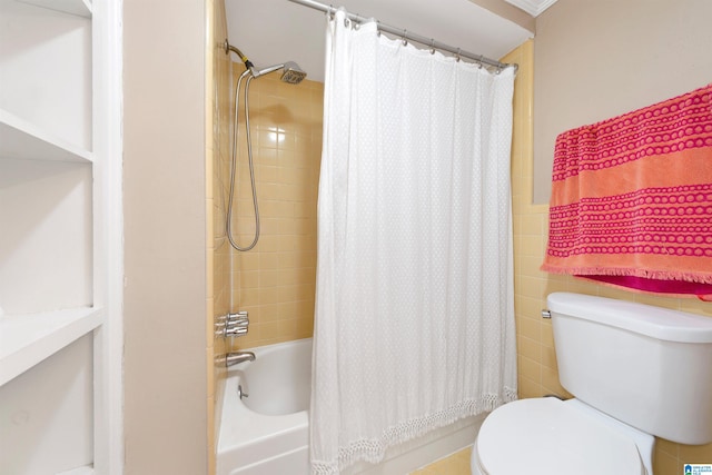 bathroom with tile walls, toilet, and shower / bathtub combination with curtain