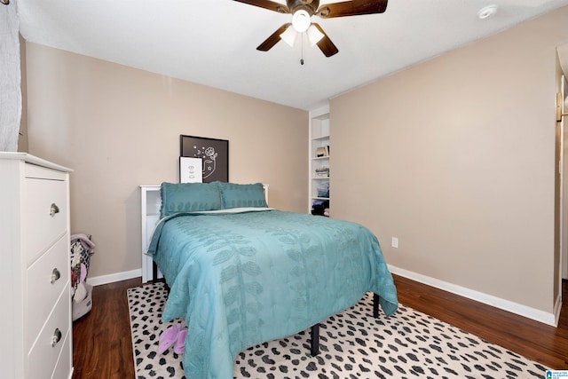 bedroom with ceiling fan and dark hardwood / wood-style floors