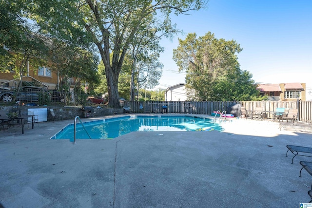 view of swimming pool featuring a patio area