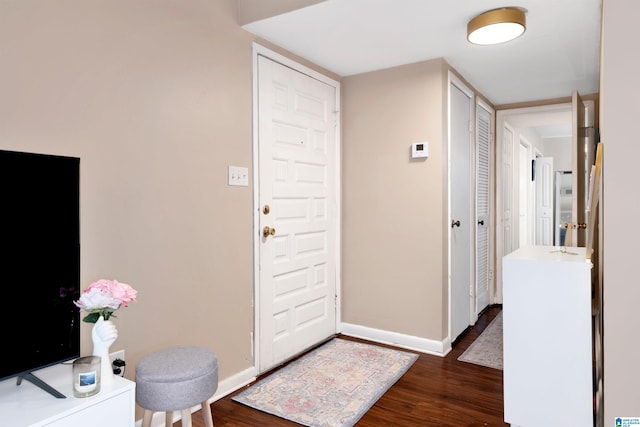 entrance foyer with dark hardwood / wood-style floors