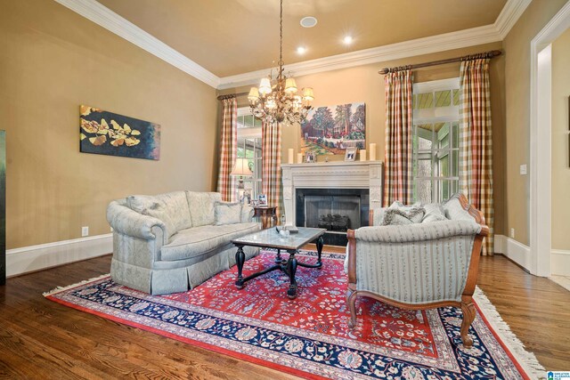 living room featuring a healthy amount of sunlight, ornamental molding, an inviting chandelier, and wood-type flooring