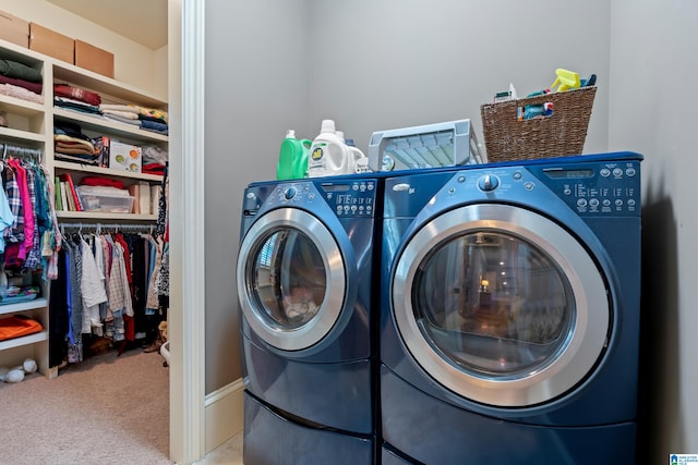 clothes washing area with carpet flooring and washer and dryer