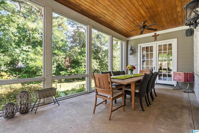 sunroom / solarium with wood ceiling, ceiling fan, plenty of natural light, and french doors