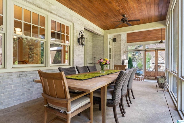 sunroom with wood ceiling and ceiling fan