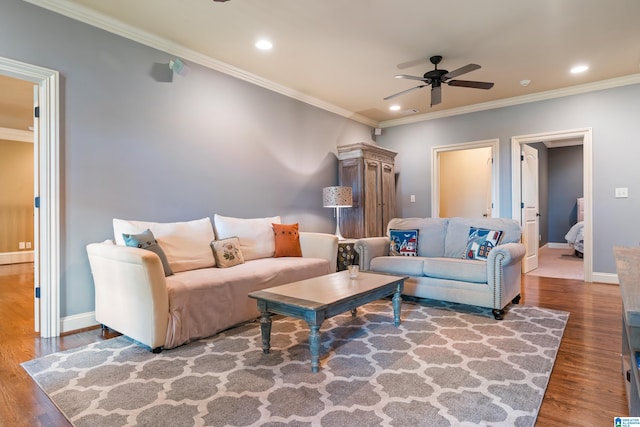 living room featuring crown molding, ceiling fan, and hardwood / wood-style flooring