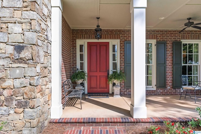 property entrance featuring a porch and ceiling fan