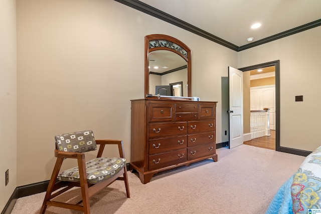 carpeted bedroom featuring crown molding