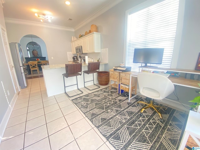 tiled home office featuring a wealth of natural light and crown molding