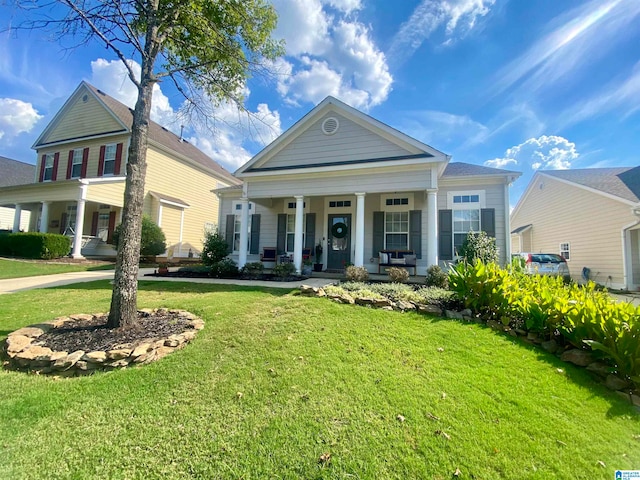 neoclassical home with a front yard and covered porch