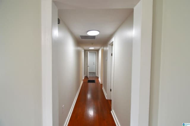 hall with dark wood-type flooring