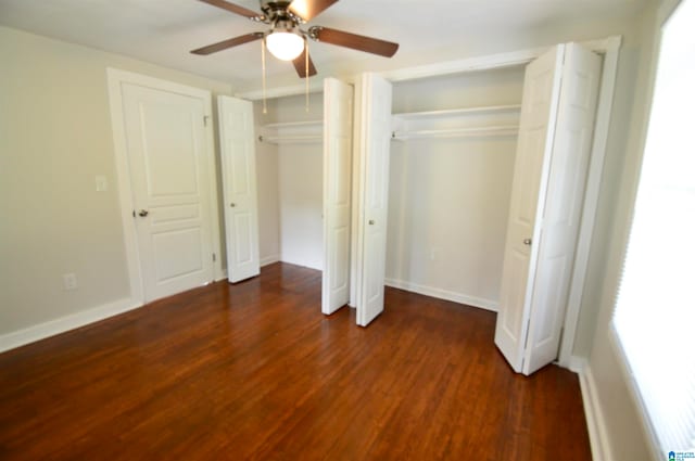 unfurnished bedroom with dark hardwood / wood-style flooring and ceiling fan