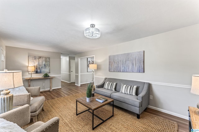 living room with a notable chandelier and hardwood / wood-style floors