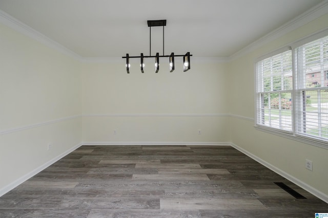 unfurnished dining area with ornamental molding and dark wood-type flooring