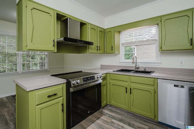 kitchen featuring wall chimney range hood, crown molding, dark wood-type flooring, sink, and stainless steel appliances