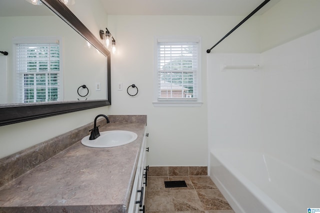 bathroom featuring shower / bathtub combination and vanity