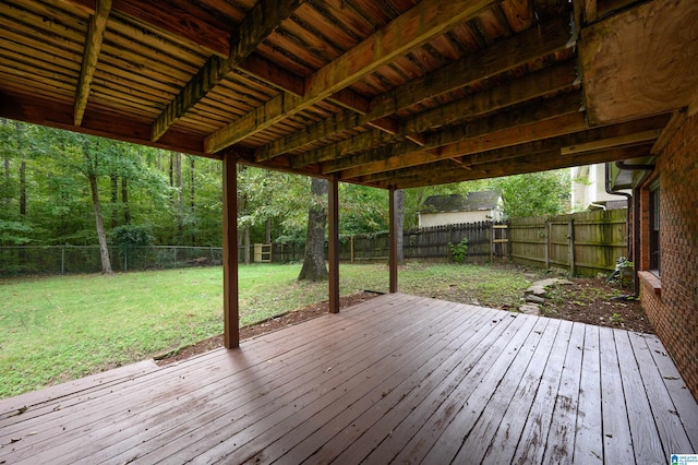 wooden terrace with a lawn