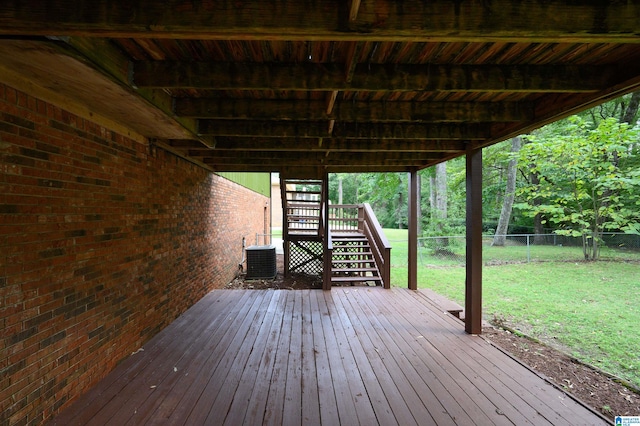 deck with a lawn and central AC