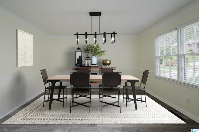 dining space featuring crown molding, a wealth of natural light, and wood-type flooring