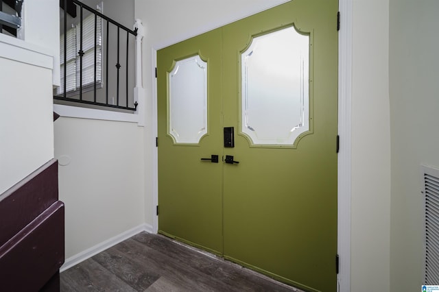 doorway to outside featuring plenty of natural light and dark wood-type flooring