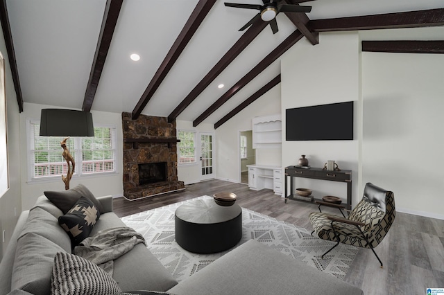 living room featuring hardwood / wood-style floors and beam ceiling