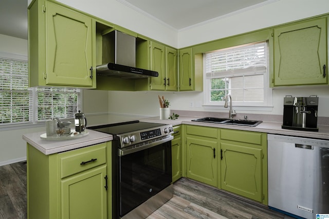 kitchen with ornamental molding, sink, wall chimney range hood, appliances with stainless steel finishes, and dark hardwood / wood-style floors