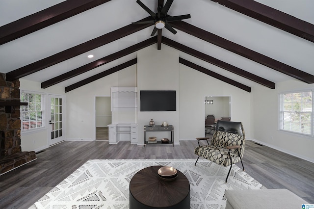 living room with hardwood / wood-style flooring, plenty of natural light, and beam ceiling