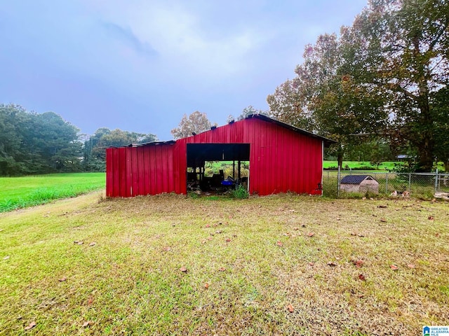 view of outdoor structure with a lawn