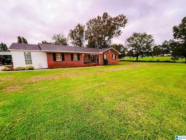 single story home featuring a front yard