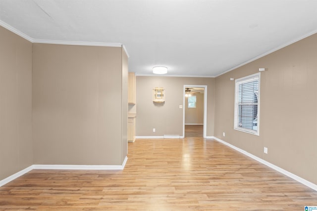 unfurnished room with ornamental molding and light hardwood / wood-style floors