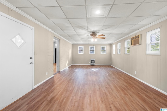 unfurnished room featuring a drop ceiling, ceiling fan, hardwood / wood-style flooring, and ornamental molding