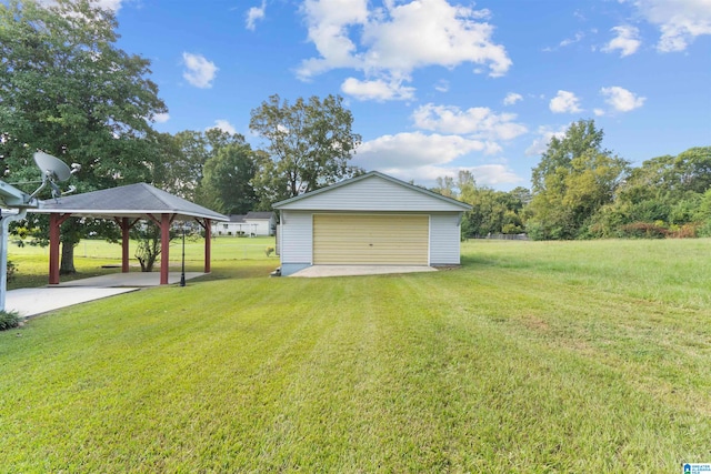 exterior space featuring a gazebo and an outbuilding