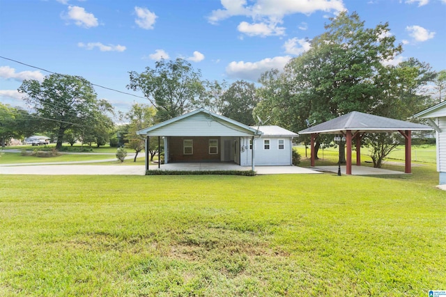 exterior space featuring a lawn and a gazebo