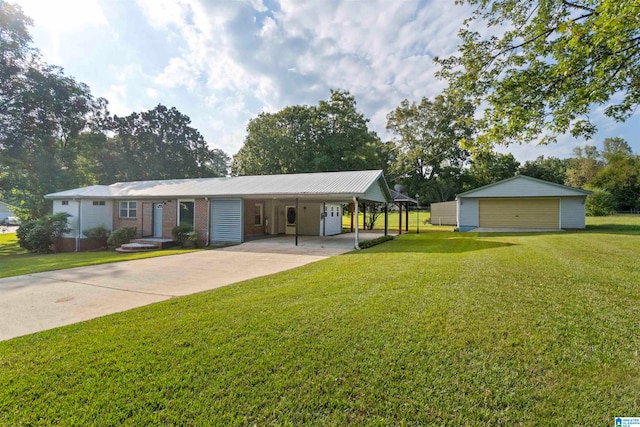 ranch-style house with a garage, a carport, a front lawn, and an outbuilding