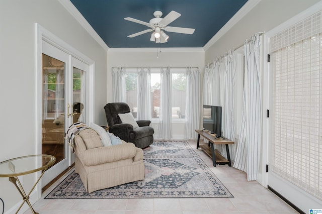 living room with ceiling fan, crown molding, and light tile patterned floors