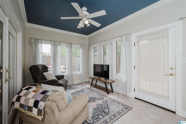 living room featuring crown molding, light tile patterned floors, and ceiling fan