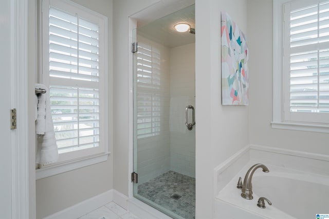 bathroom featuring plus walk in shower