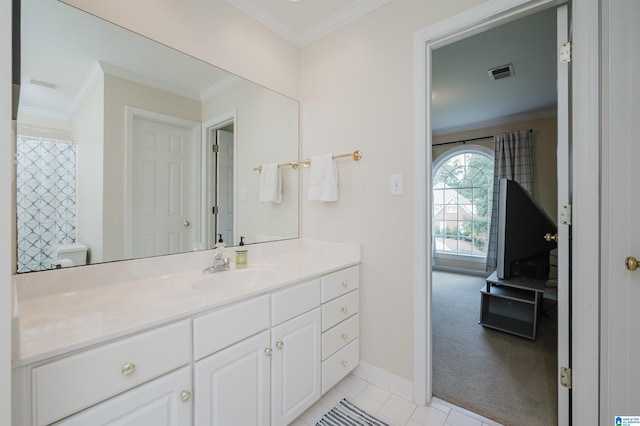 bathroom featuring ornamental molding, tile patterned floors, vanity, and toilet