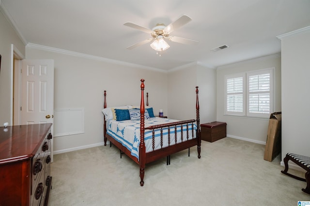 bedroom featuring ornamental molding, ceiling fan, and light colored carpet