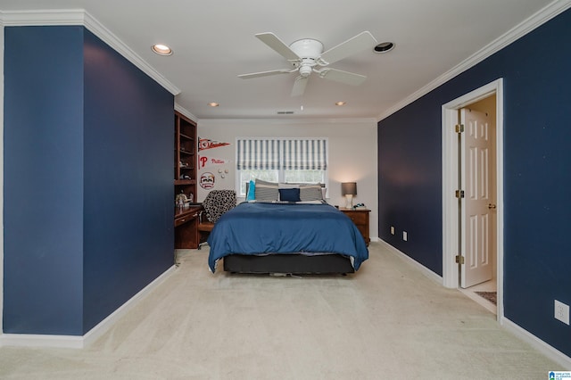 bedroom featuring ceiling fan, crown molding, and carpet flooring