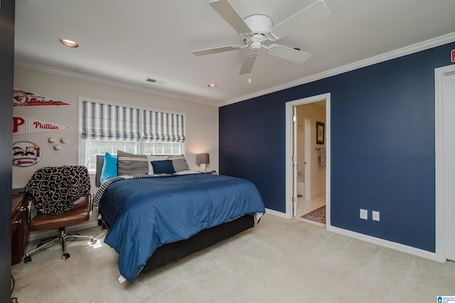 bedroom featuring ceiling fan, light carpet, ensuite bathroom, and crown molding