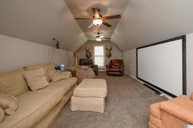 carpeted cinema room with vaulted ceiling and ceiling fan