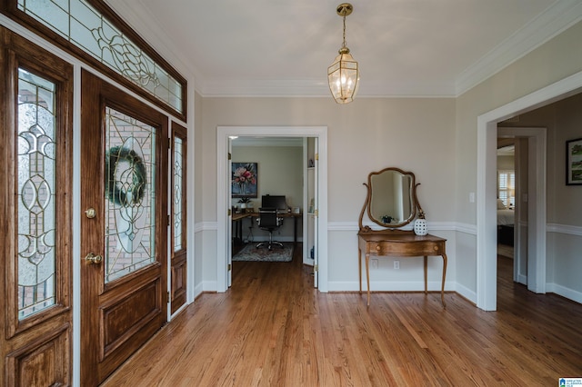 foyer featuring light hardwood / wood-style flooring and crown molding