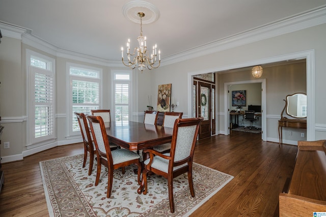 dining space featuring ornamental molding, an inviting chandelier, and dark hardwood / wood-style flooring